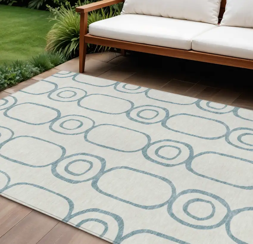 Teal Blue And Ivory Geometric Washable Indoor Outdoor Area Rug Photo 1