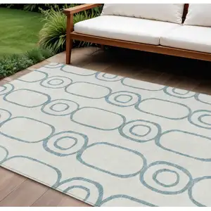 Photo of Teal Blue And Ivory Geometric Washable Indoor Outdoor Area Rug