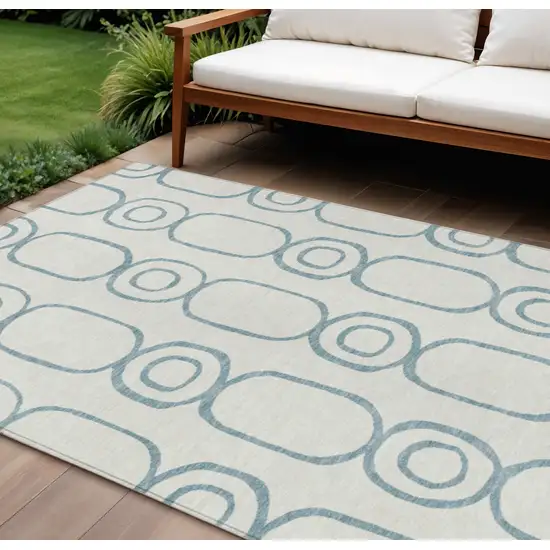 Teal Blue And Ivory Geometric Washable Indoor Outdoor Area Rug Photo 1