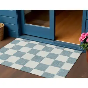 Photo of Teal Blue And Ivory Geometric Washable Indoor Outdoor Area Rug