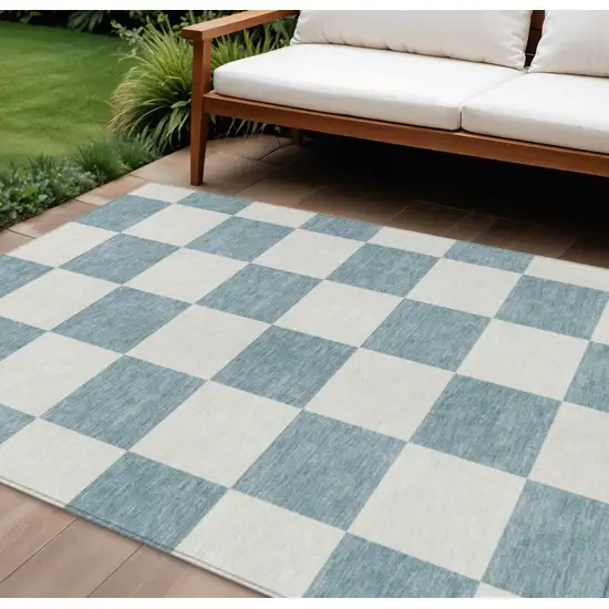 Teal Blue And Ivory Geometric Washable Indoor Outdoor Area Rug Photo 1