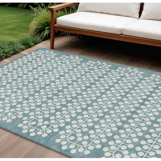 Teal Blue And Ivory Geometric Washable Indoor Outdoor Area Rug Photo 1