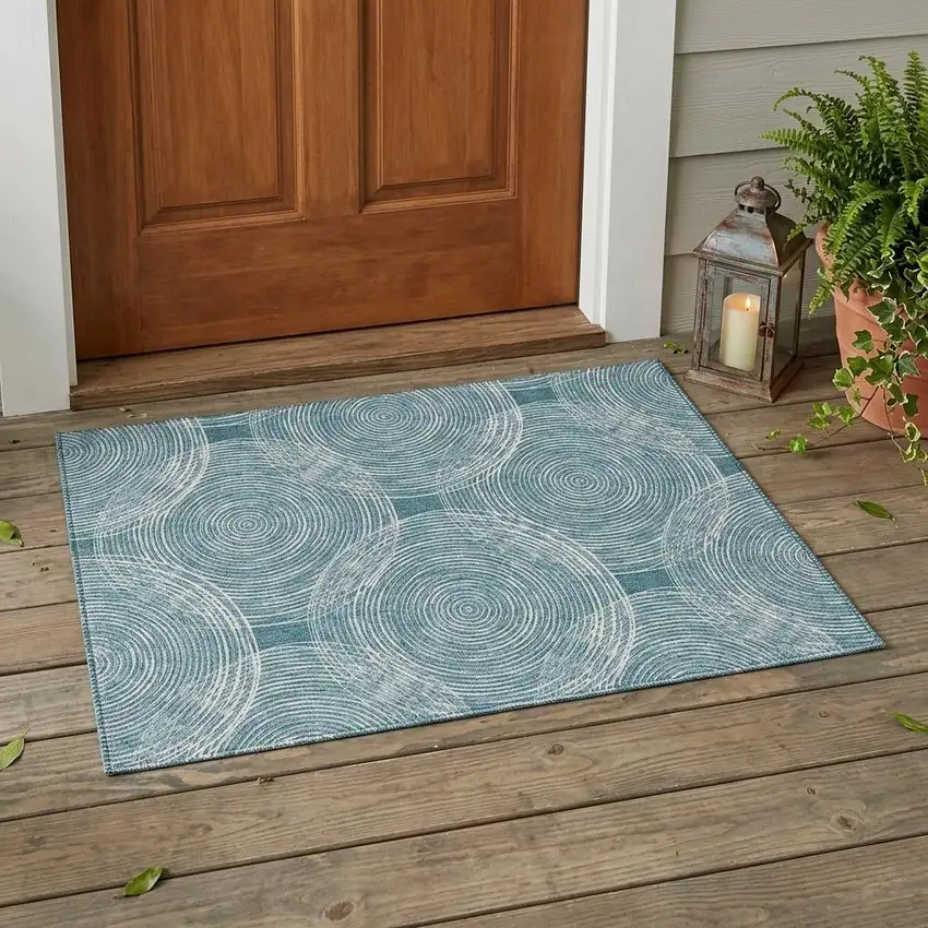 Teal Blue And Ivory Geometric Washable Indoor Outdoor Area Rug Photo 1