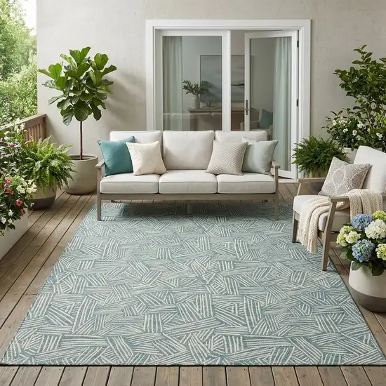 Teal Blue And Ivory Geometric Washable Indoor Outdoor Area Rug Photo 1