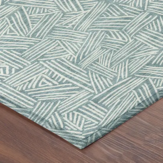 Teal Blue And Ivory Geometric Washable Indoor Outdoor Area Rug Photo 7