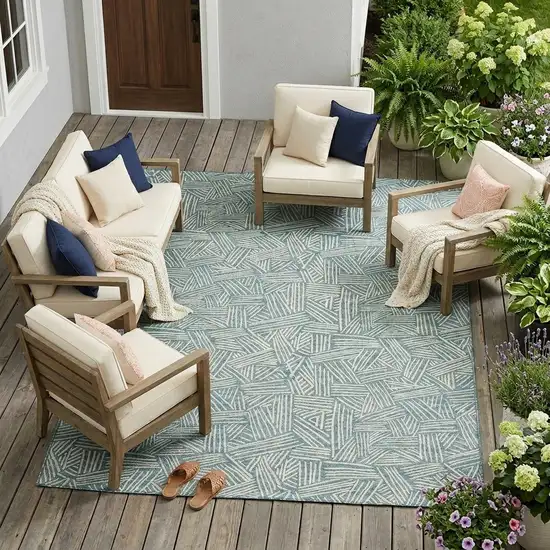 Teal Blue And Ivory Geometric Washable Indoor Outdoor Area Rug Photo 1