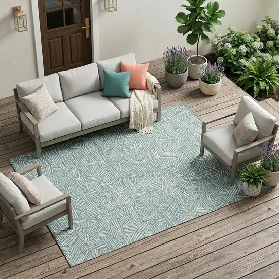 Teal Blue And Ivory Geometric Washable Indoor Outdoor Area Rug Photo 1