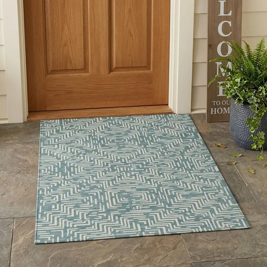 Teal Blue And Ivory Geometric Washable Indoor Outdoor Area Rug Photo 1