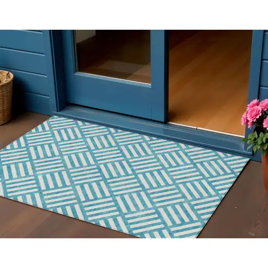 Teal Blue And Ivory Geometric Washable Indoor Outdoor Area Rug Photo 1