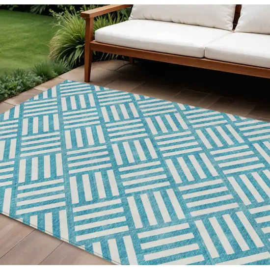 Teal Blue And Ivory Geometric Washable Indoor Outdoor Area Rug Photo 1