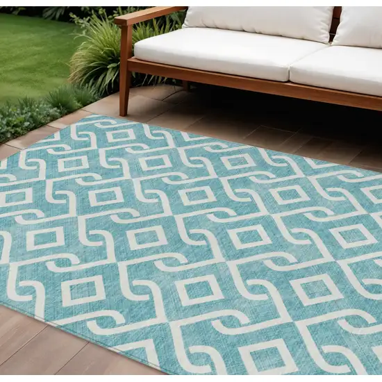 Teal Blue And Ivory Geometric Washable Indoor Outdoor Area Rug Photo 1