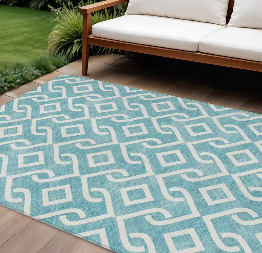 Teal Blue And Ivory Geometric Washable Indoor Outdoor Area Rug Photo 1