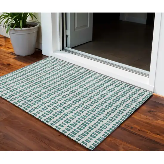 Teal Blue And Ivory Geometric Washable Indoor Outdoor Area Rug Photo 1