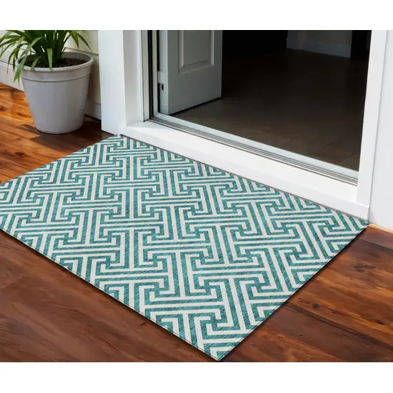 Teal Blue And Ivory Geometric Washable Indoor Outdoor Area Rug Photo 1