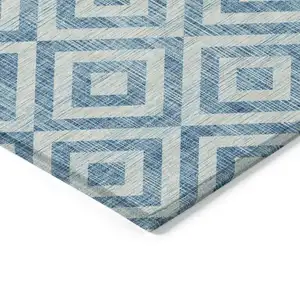 Photo of Teal Blue And Ivory Geometric Washable Indoor Outdoor Area Rug