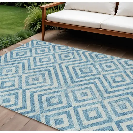 Teal Blue And Ivory Geometric Washable Indoor Outdoor Area Rug Photo 1