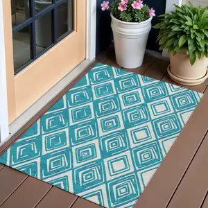 Photo of Teal Blue And Ivory Geometric Washable Indoor Outdoor Area Rug