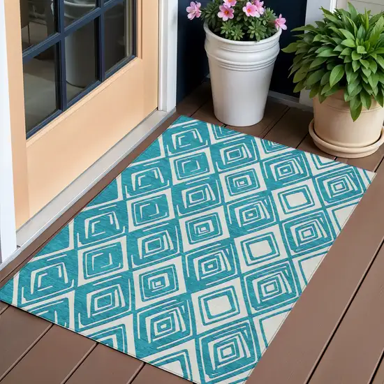Teal Blue And Ivory Geometric Washable Indoor Outdoor Area Rug Photo 1
