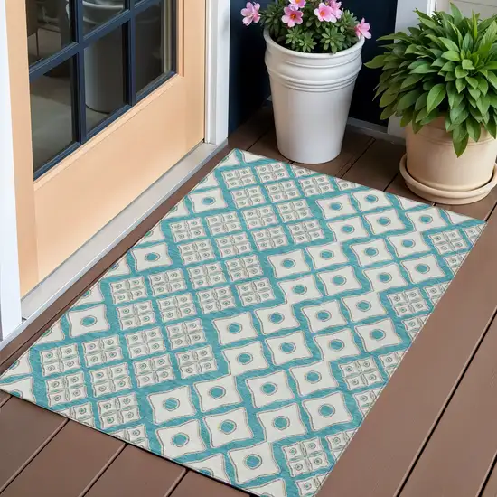 Teal Blue And Ivory Geometric Washable Indoor Outdoor Area Rug Photo 1