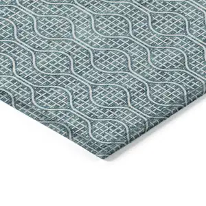 Photo of Teal Blue And Ivory Geometric Washable Indoor Outdoor Area Rug