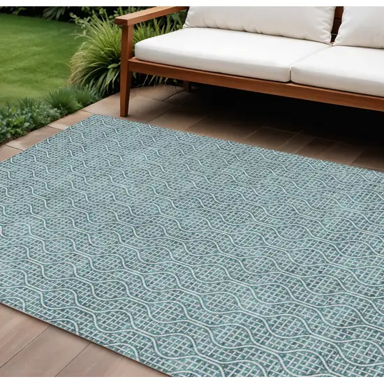 Teal Blue And Ivory Geometric Washable Indoor Outdoor Area Rug Photo 1