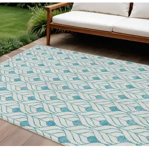 Photo of Teal Blue And Ivory Geometric Washable Indoor Outdoor Area Rug