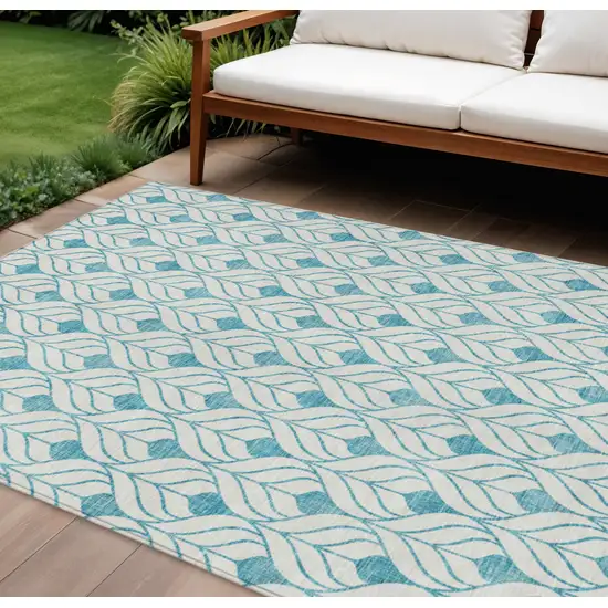 Teal Blue And Ivory Geometric Washable Indoor Outdoor Area Rug Photo 1