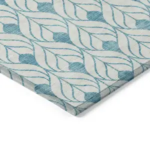 Photo of Teal Blue And Ivory Geometric Washable Indoor Outdoor Area Rug