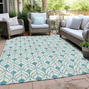 Photo of Teal Blue And Ivory Geometric Washable Indoor Outdoor Area Rug