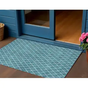 Photo of Teal Blue And Ivory Geometric Washable Indoor Outdoor Area Rug