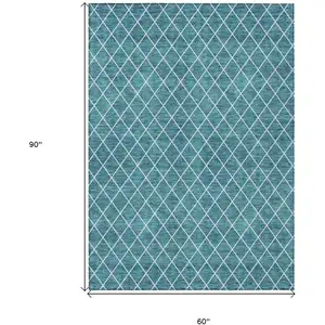Photo of Teal Blue And Ivory Geometric Washable Indoor Outdoor Area Rug