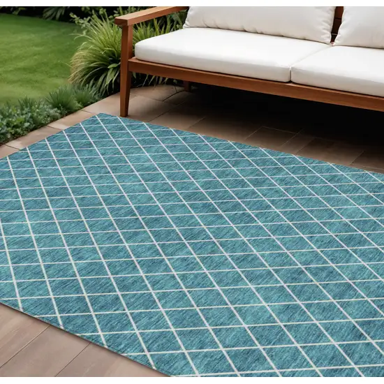 Teal Blue And Ivory Geometric Washable Indoor Outdoor Area Rug Photo 1
