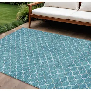 Photo of Teal Blue And Ivory Geometric Washable Indoor Outdoor Area Rug