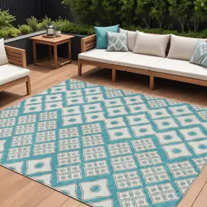 Photo of Teal Blue And Ivory Geometric Washable Indoor Outdoor Area Rug