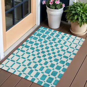 Photo of Teal Blue And Ivory Geometric Washable Indoor Outdoor Area Rug