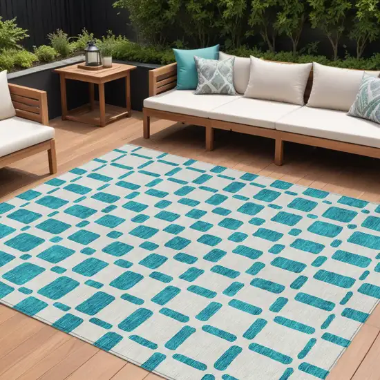 Teal Blue And Ivory Geometric Washable Indoor Outdoor Area Rug Photo 1