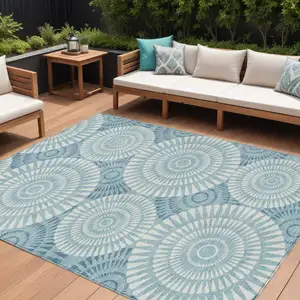 Photo of Teal Blue And Ivory Geometric Washable Indoor Outdoor Area Rug