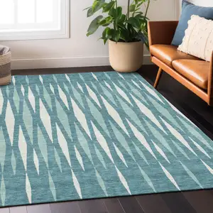 Photo of Teal Blue And Ivory Geometric Washable Indoor Outdoor Area Rug