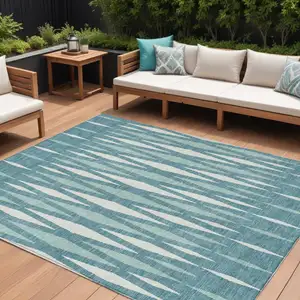 Photo of Teal Blue And Ivory Geometric Washable Indoor Outdoor Area Rug