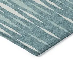 Photo of Teal Blue And Ivory Geometric Washable Indoor Outdoor Area Rug