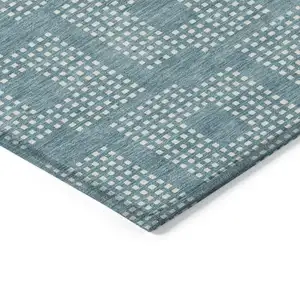 Photo of Teal Blue And Ivory Geometric Washable Indoor Outdoor Area Rug