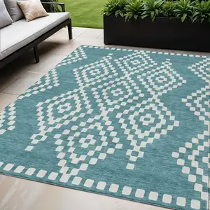 Photo of Teal Blue And Ivory Geometric Washable Indoor Outdoor Area Rug
