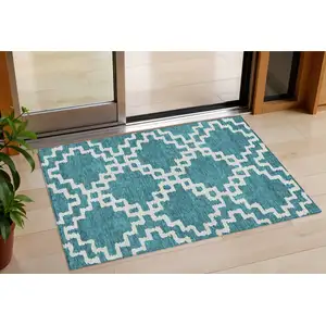 Photo of Teal Blue And Ivory Geometric Washable Indoor Outdoor Area Rug