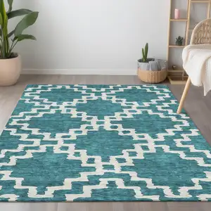 Photo of Teal Blue And Ivory Geometric Washable Indoor Outdoor Area Rug