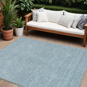 Photo of Teal Blue And Ivory Geometric Washable Indoor Outdoor Area Rug