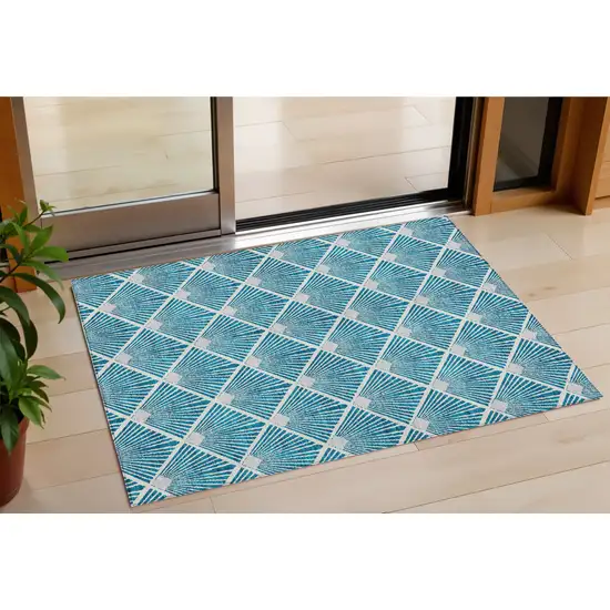 Teal Blue And Ivory Geometric Washable Indoor Outdoor Area Rug Photo 1