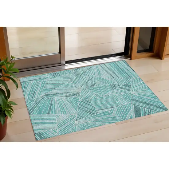 Teal Blue And Ivory Geometric Washable Indoor Outdoor Area Rug Photo 1