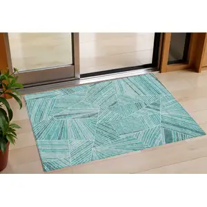 Photo of Teal Blue And Ivory Geometric Washable Indoor Outdoor Area Rug