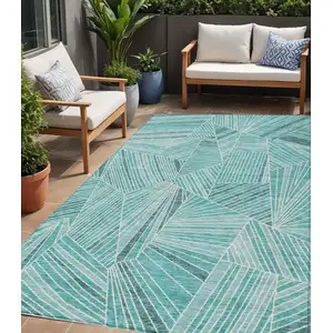 Photo of Teal Blue And Ivory Geometric Washable Indoor Outdoor Area Rug