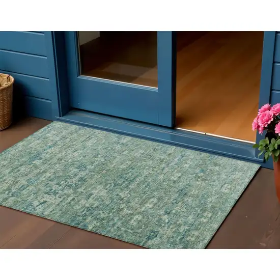 Teal Blue And Ivory Ikat Washable Indoor Outdoor Area Rug Photo 1